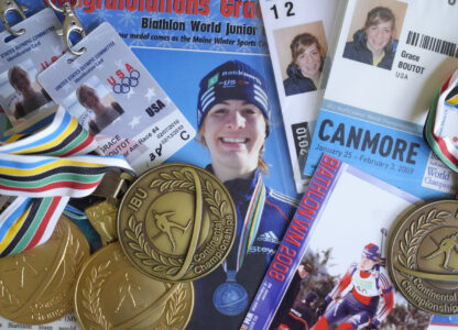 FILE - Biathlon competition medals, credentials and media clippings belonging to Grace Boutot, silver medalist in Youth World Championships in 2009, are displayed for a photograph at her home on Oct. 17, 2024, in Boston. (AP Photo/Steven Senne, File)