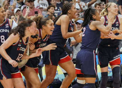 UConn players react late in the second half of the national championship game against South Carolina at the Final Four of the women's NCAA college basketball tournament, Sunday, April 6, 2025, in Tampa, Fla. (AP Photo/John Raoux)