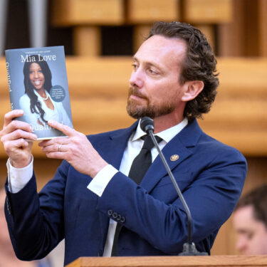 Husband Jason Love speaks at funeral services for former U.S. Rep. Mia Love at the University of Utah Institute of Religion in Salt Lake City on Monday, April 7, 2025. (Rick Egan/The Salt Lake Tribune via AP, Pool)