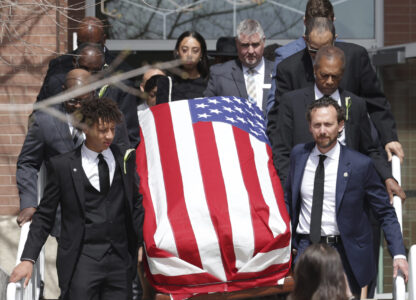Peyton Love, front left, and Jason Love, front right, carry the casket of their mother and wife, former U.S. Rep. Mia Love, to a hearse after her memorial service at The Church of Jesus Christ of Latter-day Saints on the University of Utah campus in Salt Lake City, Monday, April 7, 2025. (AP Photo/Melissa Majchrzak)