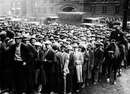 FILE - Thousands of unemployed people gather outside City Hall in Cleveland during the Great Depression, after some 2,000 jobs were made available for park improvements and repairs, Oct. 9, 1930. (AP Photo, File)