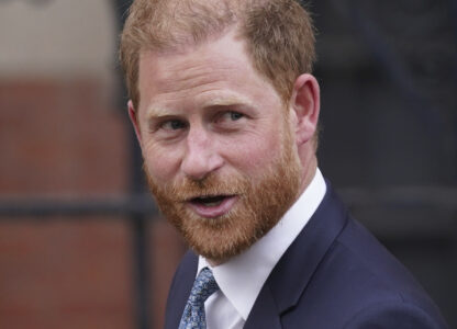 Britain's Prince Harry looks towards the media as he leaves the Royal Courts of Justice in London, Tuesday, April 8, 2025. (AP Photo/Alberto Pezzali)