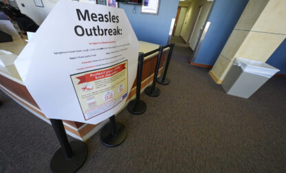 FILE - A measles sign is seen at the Texas Tech University Health Sciences Center, Feb. 25, 2025, in Lubbock, Texas. (AP Photo/Julio Cortez, file)