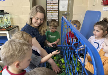 FILE - Rylee Monn plays with children in her class at a child care center in Lexington, Ky., March 13, 2024. (AP Photo/Dylan Lovan, File)