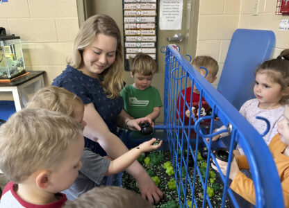 FILE - Rylee Monn plays with children in her class at a child care center in Lexington, Ky., March 13, 2024. (AP Photo/Dylan Lovan, File)