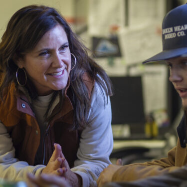 This image provided by Idaho Education News shows Brittany Ohman, an advisor for the Hope Squad, talking with Cutter Wasylow and another student during a Hope Squad class at Rigby High School in Rigby, Idaho on Wednesday, Feb. 5, 2025. (John Roark/Idaho Education News via AP)