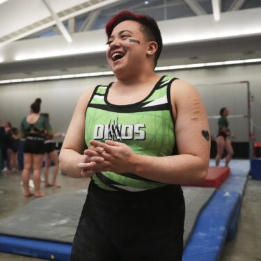 Raiden Hung, of Jurassic Gymnastics in Boston, relaxes after competing on the uneven bars at the 2025 NAIGC national competition in Pittsburgh, Friday, April 4, 2025. (AP Photo/Gene J. Puskar)