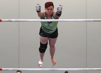 Raiden Hung, of Jurassic Gymnastics in Boston, competes on the uneven bars at the 2025 NAIGC national competition in Pittsburgh, Friday, April 4, 2025. (AP Photo/Gene J. Puskar)