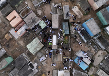 Family and friends attend the burial service for Marilenny Pilarte who died at the Jet Set nightclub when its roof collapsed, in Haina, Dominican Republic, Thursday, April 10, 2025. (AP Photo/Matias Delacroix)
