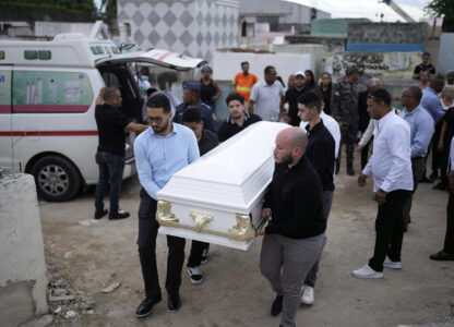 Relatives carry the coffin that contain the remains of Marilenny Pilarte who died at the Jet Set nightclub when its roof collapsed, during a burial service at a cemetery in Haina, Dominican Republic, Thursday, April 10, 2025. (AP Photo/Matias Delacroix)