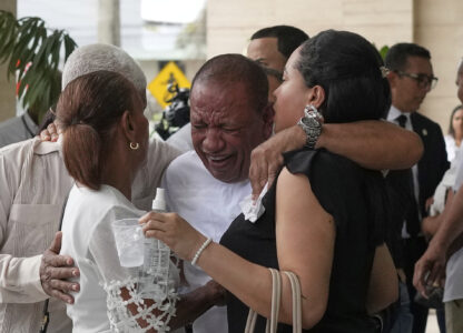 Family members mourn during the memorial of Octavio Dotel, a former MLB baseball player who died at the Jet Set nightclub where more than 200 people were killed when its roof collapsed, in Santo Domingo, Dominican Republic, Thursday, April 10, 2025. (AP Photo/Matias Delacroix)