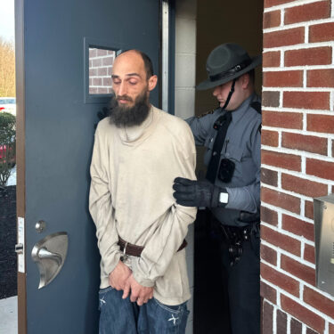 Cody Balmer is taken from a courtroom Monday, April 14, 2025, in Harrisburg, Pa., after being denied bail for charges he broke into the governor's residence and started a fire that did extensive damage. (AP Photo/Mark Scolforo)