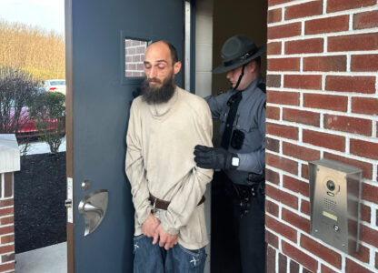 Cody Balmer is taken from a courtroom Monday, April 14, 2025, in Harrisburg, Pa., after being denied bail for charges he broke into the governor's residence and started a fire that did extensive damage. (AP Photo/Mark Scolforo)
