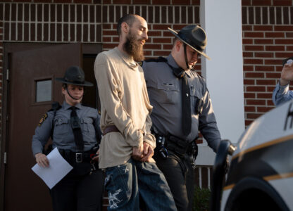 Cody Balmer is escorted from court after his preliminary arraignment on Monday, April 14, 2025, in Harrisburg, Pa. (AP Photo/Mingson Lau)