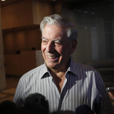 FILE - Writer Mario Vargas Llosa speaks to reporters in New York, Oct. 7, 2010. (AP Photo/Seth Wenig, File)