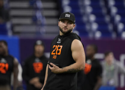FILE - Arizona State running back Cam Skattebo watches as running back prospects run the 40-yard dash at the NFL football scouting combine in Indianapolis, on March 1, 2025. (AP Photo/George Walker IV, File)