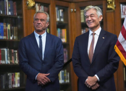 U.S. Health and Human Services Secretary Robert F. Kennedy, Jr., left, and Centers for Medicare and Medicaid Services Administrator Dr. Mehmet Oz listen during a Make Indiana Healthy Again initiative event in Indianapolis, Tuesday, April 15, 2025. (AP Photo/Michael Conroy)