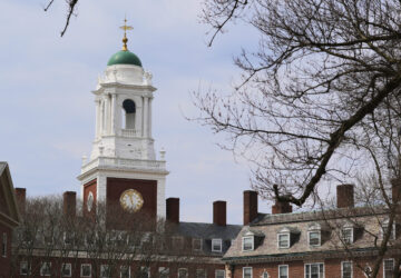 Spring buds appear on a tree near Eliot House, rear, at Harvard University, Tuesday, April 15, 2025, in Cambridge, Mass. (AP Photo/Charles Krupa)