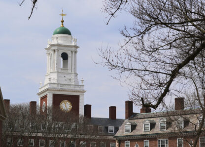 Spring buds appear on a tree near Eliot House, rear, at Harvard University, Tuesday, April 15, 2025, in Cambridge, Mass. (AP Photo/Charles Krupa)