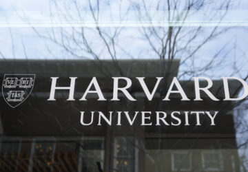 The Harvard University logo is displayed on a building at the school, Tuesday, April 15, 2025, in Cambridge, Mass. (AP Photo/Charles Krupa)