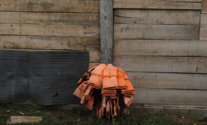 Lifejackets hang at the home of a local in Villa Caleta, Panama, Monday, April 7, 2025. The jackets were once used to ferry migrants after their trek across the Darien Gap on their way north to the U.S. (AP Photo/Matias Delacroix)