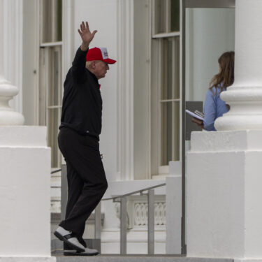 Trump waves