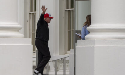 Trump waves