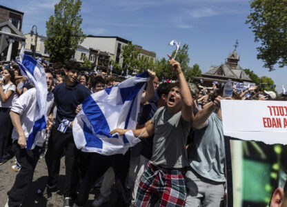 People gathered in Huyler Park celebrate the release of American hostage Edan Alexander from Hamas on Monday, May 12, 2025, in Tenafly, N.J. (AP Photo/Stefan Jeremiah)