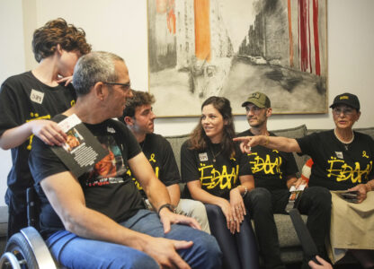 Relatives and friends of Israeli-American soldier Edan Alexander gather to watch the TV broadcast of his release from Hamas captivity in Gaza, in Tel Aviv, Monday, May 12, 2025. Alexander was abducted during the Hamas-led attack on his base on October 7, 2023. (AP Photo/Ohad Zwigenberg)