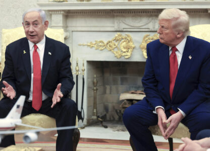 FILE - President Donald Trump, right, listens as Israel's Prime Minister Benjamin Netanyahu speaks during a meeting in the Oval Office at the White House in Washington, April 7, 2025. (Pool via AP, file)