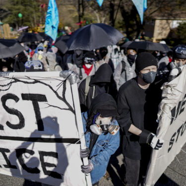 FILE - Protesters march during a demonstration in opposition to a new police training center on Nov. 13, 2023, in Atlanta. (AP Photo/Mike Stewart, File)