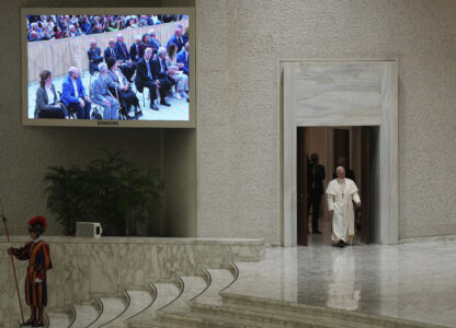 Pope Leo XIV arrives to meet with members of the international media in the Paul VI Hall at the Vatican, Monday, May 12, 2025. (AP Photo/Domenico Stinellis)