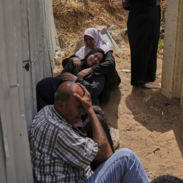 Palestinians mourn their relatives who were killed in Israeli airstrikes on a medical center in Jabalia, northern Gaza Strip, on Thursday, May 15, 2025. (AP Photo/Jehad Alshrafi)