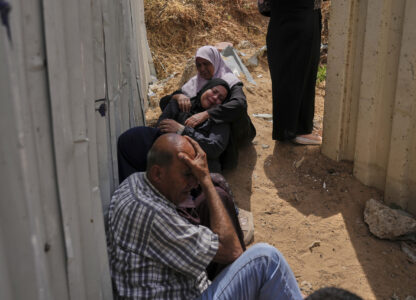 Palestinians mourn their relatives who were killed in Israeli airstrikes on a medical center in Jabalia, northern Gaza Strip, on Thursday, May 15, 2025. (AP Photo/Jehad Alshrafi)