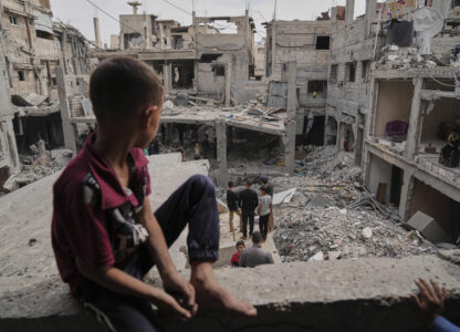 Palestinians inspect the rubble of the Al-Lahham family's home, destroyed by Israeli airstrikes in Khan Younis, Gaza Strip, on Thursday, May 15, 2025. (AP Photo/Abdel Kareem Hana)