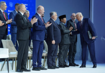 President Donald Trump, right, greets leaders as he arrives for a Board of Peace charter announcement during the Annual Meeting of the World Economic Forum in Davos, Switzerland, Thursday, Jan. 22, 2026. (AP Photo/Evan Vucci)