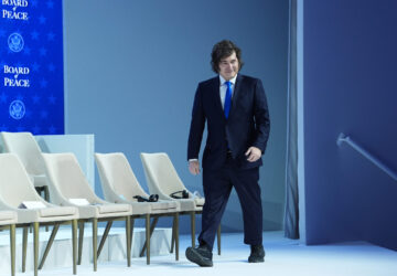 Javier Milei, President of Argentina, arrives for a Board of Peace charter announcement during the Annual Meeting of the World Economic Forum in Davos, Switzerland, Thursday, Jan. 22, 2026. (AP Photo/Evan Vucci)