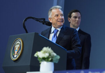 United States Mideast envoy Steve Witkoff, left, and Jared Kushner address the audience after the signing of a Board of Peace charter during the Annual Meeting of the World Economic Forum in Davos, Switzerland, Thursday, Jan. 22, 2026. (AP Photo/Evan Vucci)