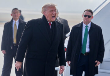 President Donald Trump, center, speaks as he steps off Air Force One after arriving at Zurich International Airport for the World Economic Forum, Wednesday, Jan. 21, 2026, in Zurich, Switzerland. (AP Photo/Evan Vucci)