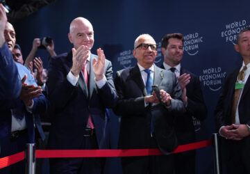 FIFA President Gianni Infantino, center left, applauds after President Donald Trump delivered an address during a meeting of Global Business Leaders at the Annual Meeting of the World Economic Forum in Davos, Switzerland, Wednesday, Jan. 21, 2026. (AP Photo/Evan Vucci)