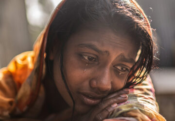 FILE - Meghna Rani, wife of Dipu Chandra Das who was beaten to death by a mob, his body hung from a tree and set on fire, for alleging making derogatory remarks about the Prophet Muhammad, weeps inside her home in Tarakanda, Bangladesh, Jan. 9, 2026. (AP Photo/Mahmud Hossain Opu, File)