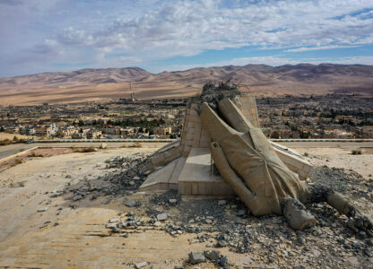 A statue of the late Syrian President Hafez Assad, which was toppled and defaced during the uprising that overthrew the Assad regime last December, lies in ruins atop a mountain in Dayr Atiyah, Syria, Jan. 5, 2025. (AP Photo / Ghaith Alsayed)